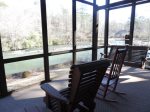 Screened in Porch with Rockers and Porch Swing Over Looking the River